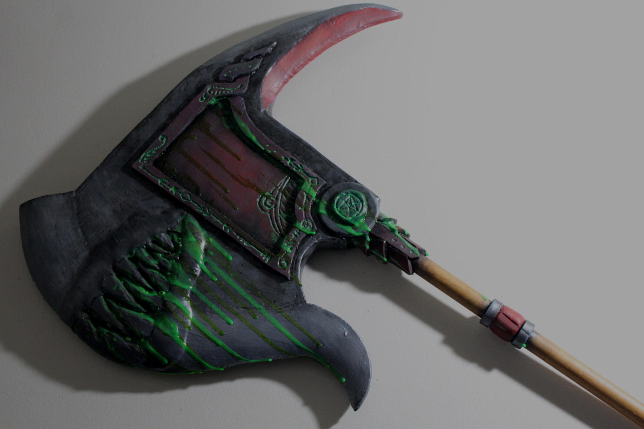 A prop weapon I made for an old D&D campaign, he's a mimic disguised as an axe and his name is Trevor. His corrosive saliva is made of green glitter paint and modpodge.