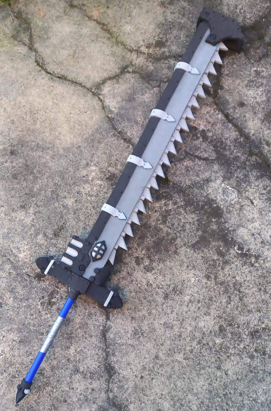 My rendition of a Warhammer 40k Chainsword, awaiting painting. Made from EVA foam and PVC pipe, with a wooden dowel which proved essential for structural integrity, I always swing my unfinished prop weapons around for a reason.