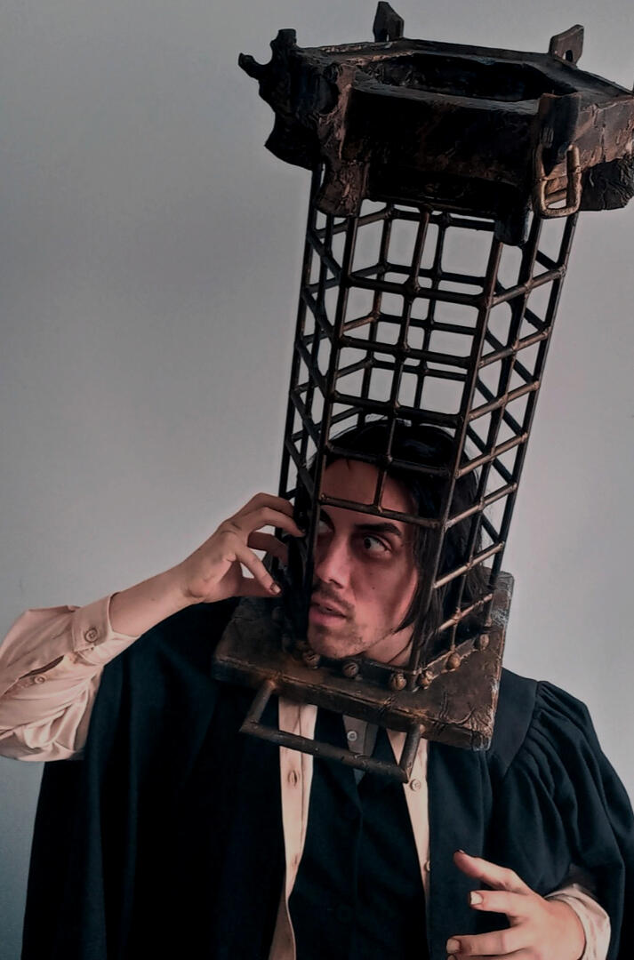 Myself as Bloodborne's Micolash, Host of the Nightmare. Wearing the Cage of Mensis which I crafted from wood dowel, worbla, and EVA foam.